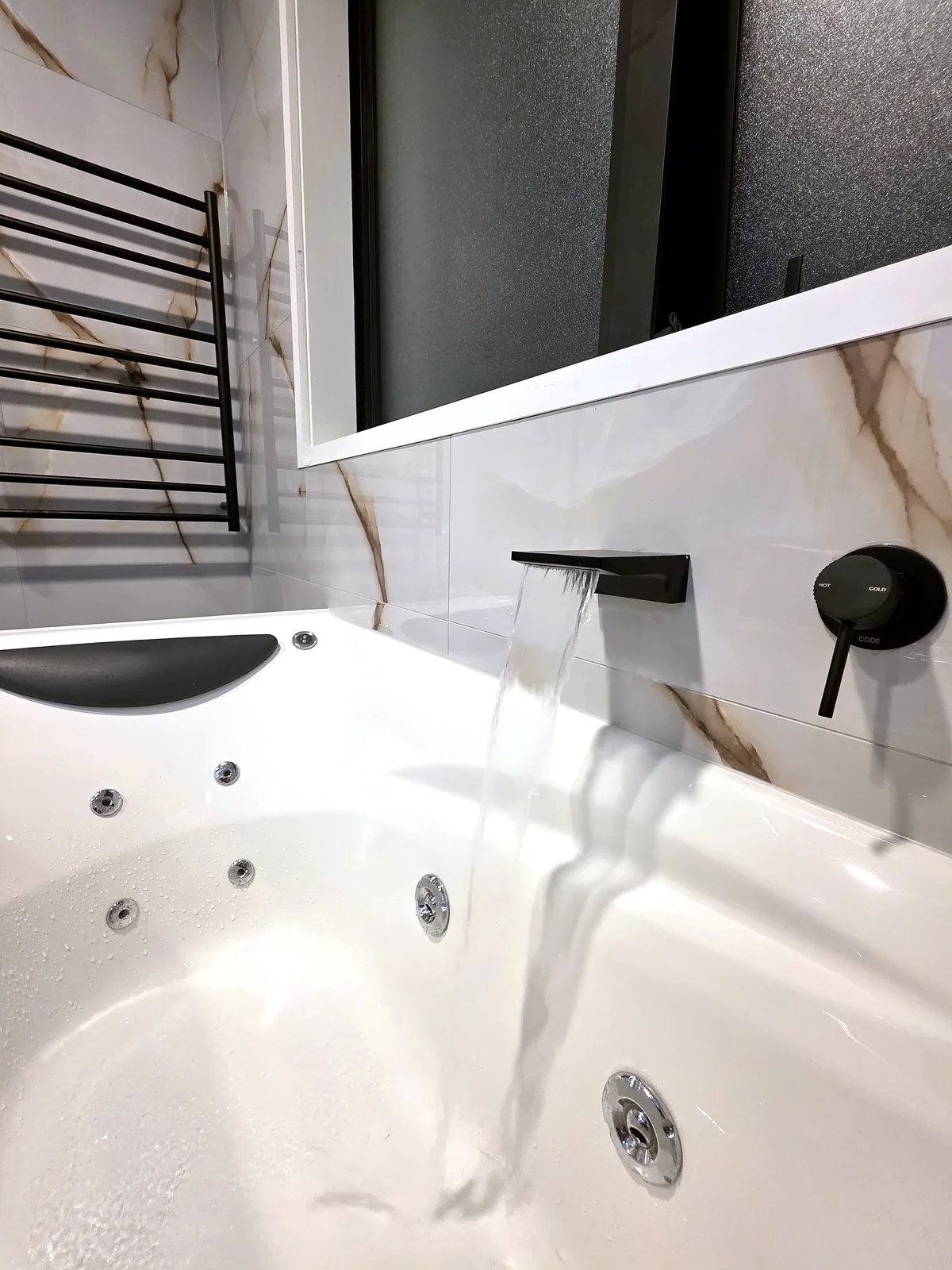 Bathroom renovation in Onehunga, Auckland — Black tapware & tiling, by HouseMakeover